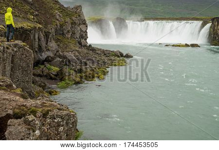 Scenic waterfall in pristine nature landscape of Iceland