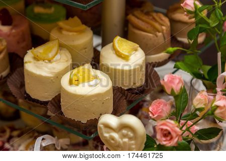 Dessert table for a party. Ombre cake, cupcakes. Wedding