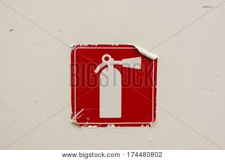 Fire extinguisher symbol in red and white squares