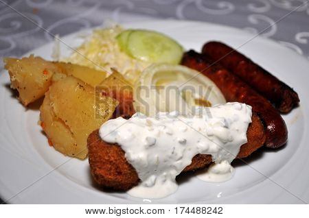 Beautifully decorated with the white plate of homemade dishes. Kara