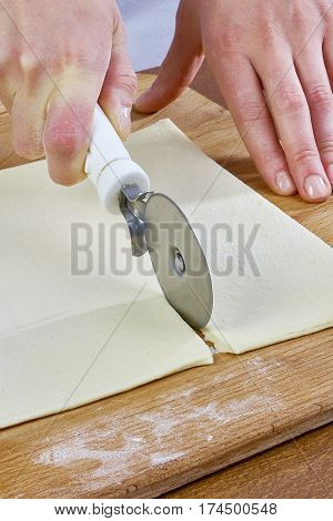 Making Croissant Cookies with Jam. Series. Cutting dough with cutter Handmade Series Food recipes Food being prepared and cooked in a contemporary kitchen, with and without the chef