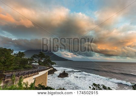 Coastline Road With Mt. Kaimon Volcano In Beautiful Sunset, Kagoshima, Kyushu, Japan.