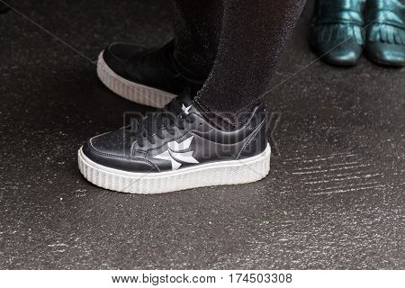 MILAN ITALY - FEBRUARY 23: Detail of shoes outside Les Copains fashion show during Milan Women's Fashion Week on FEBRUARY 23 2017 in Milan.
