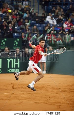 BELGRADE, SERBIA - MARCH 7: Novak Djokovic plays against John Isner in the Davis Cup 2010 on March 7, 2010 in Belgrade, Serbia.