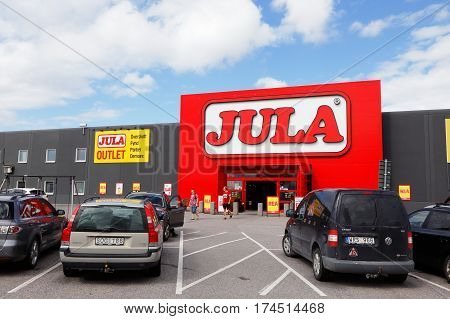 Eskilstuna Sweden - August 5 2016:Parking lot with cars parked in front of the building with the department store Jula at Folkesta west of Eskilstuna.
