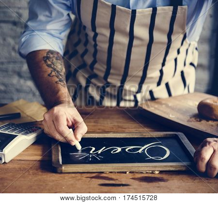 People Hand Writing Open on Chalk Board