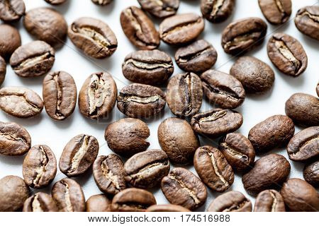 roasted coffee beans isolated in white background.