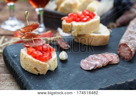 Making Pintxo With Tomato And Sausages, Tapas, Spanish Canapes Party Finger Food