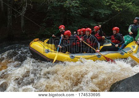 Bala Wales United Kingdom - September 10 2016: White water rafters shooting the rapids at the National White Water Centre on the River Tryweryn