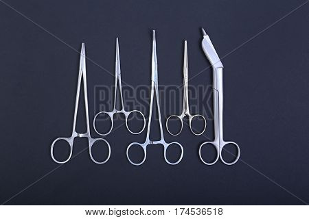 Surgical instruments and tools on table for a surgery.