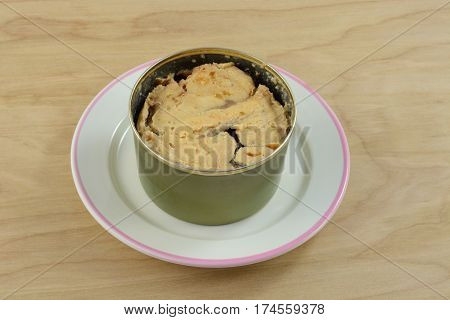 Canned wild caught Alaska pink salmon in can on plate