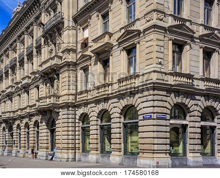 Zurich, Switzerland - 14 May, 2015: building on the corner of Paradeplatz square and Bahnhofstrasse street. Bahnhofstrasse is Zurich's main downtown street and one of the world's most expensive and exclusive shopping avenues.