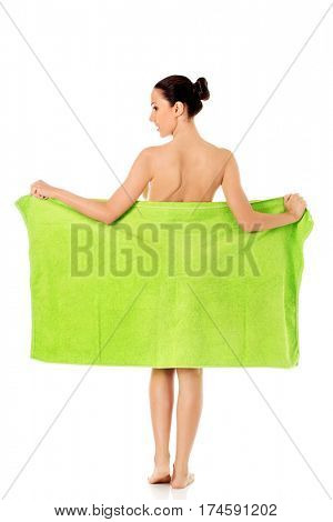 Young beautiful woman after bath full portrait isolated over white.