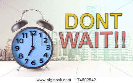 Dont wait with clock on city background concept