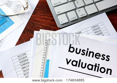 Business valuation written in a document business charts.