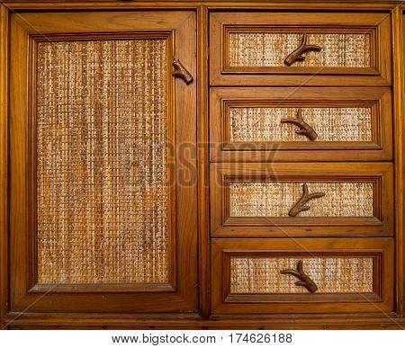 Old cabinet doors made of wood advocating substance.