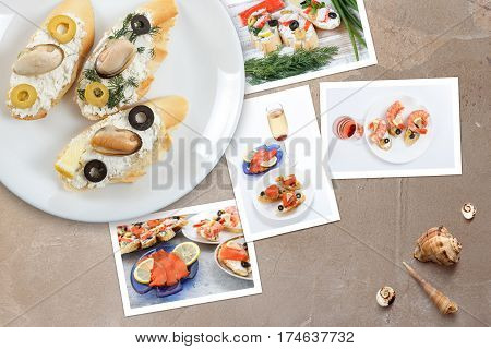 Beautiful snapshots of various italian sandwiches with seafood arranged on rustic wooden background with plates with food and seashells with copy space horizontal top view.