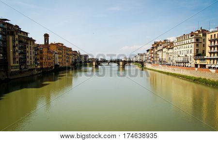 panorama of ponte vecchio in florence italy on arno river and blue sky background