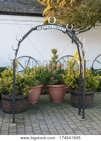 Wedding arch at the Gretna Green blacksmith, the place in Scotland where eloped couples get married over the blacksmith anvil