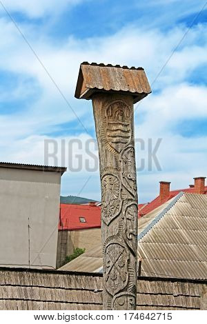 Wooden pillar on the area of reformed Church (Elizabethan church XIII c.), Khust, Ukraine