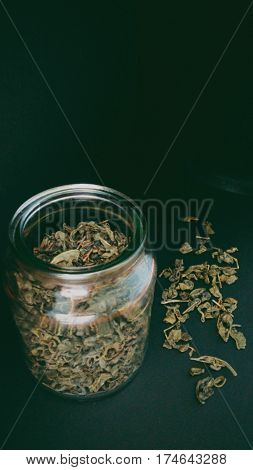 Green loose leaf tea,  herbal tea,  loose leaf tea on black background, Processed with VSCO with 6 preset