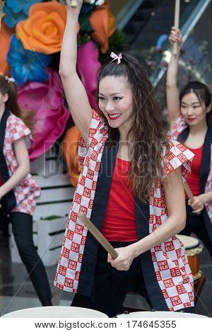 Moscow, Russia - March 5, 2017: Group Of Japanese Taiko Drummers Girls Perform In 