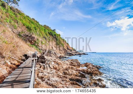 Beautiful seascape with rocks and meadow in cloudy blue sky at Khao Leam Ya National Park Rayong province Thailand