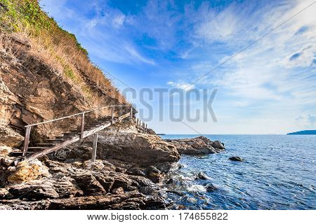 Beautiful seascape with rocks and meadow in cloudy blue sky at Khao Leam Ya National Park Rayong province Thailand