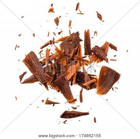 Chocolate chips and curls on white background. Top view.