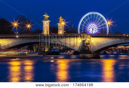 The bridge (Pont) des Invalides at night Paris France. The bridge is constructed for the upcoming 1855 World Fair in Paris.