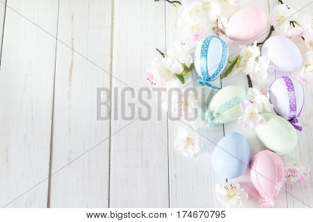 Decorated Easter eggs on a white background with flowers