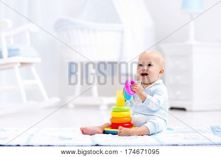 Baby Playing With Toy Pyramid. Kids Play