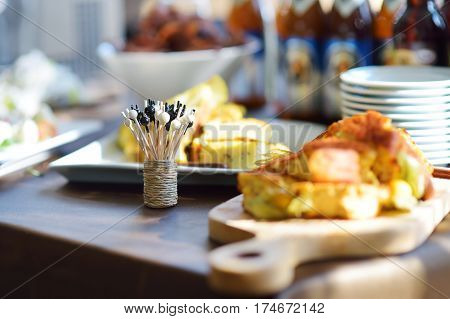 Different Kinds Of Wine Snacks And Variuos Cheeses On A Table