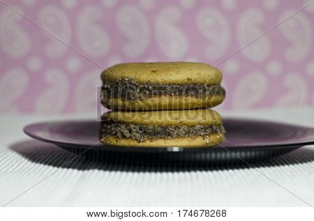 Homemade honey cookies with walnut stacked with jam