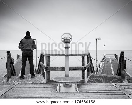 Man On Long Touristic Mole, Autumn Cold Morning. Tourist At Handrail.