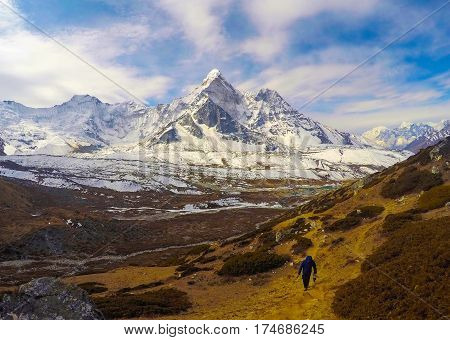 Mountain landscape of Nepal National Park. Nepalese people and severe nature. Icy and snowy peak of Kala Pattar. Himalaya trekking and mountaineering card or banner template. Sagarmatha sanctuary