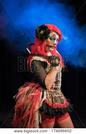 Theatrical lighting, special effects, and a custom makeup bring this evil clown to life. This is her circus now