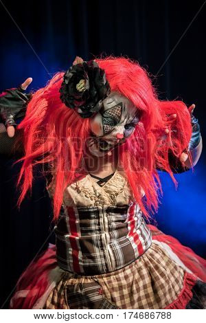 Theatrical lighting, special effects, and a custom makeup bring this evil clown to life. This is her circus now