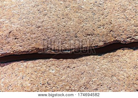 Close up of cracked rock fragment with texture