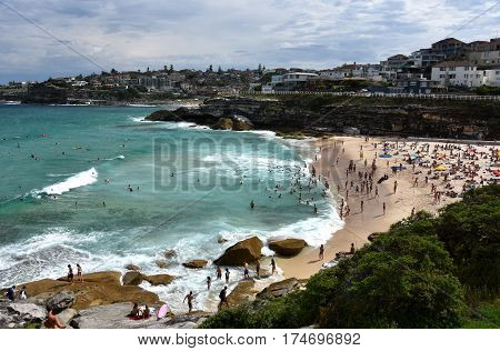 Sydney Australia - Feb 5 2017. People relaxing swimming and sun bathing on Tamarama beach.