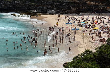 Sydney Australia - Feb 5 2017. People relaxing swimming and sun bathing on Tamarama beach.