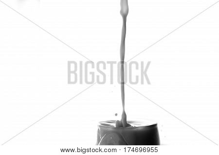 Milk in black and white/  Milk is a great source of calcium, which is essential for healthy bones