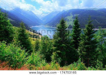Amazing summer morning on the fantastic Speicher Durlassboden lake. Alps, Austria, Europe.