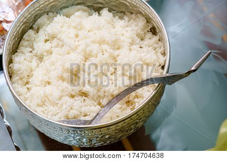 cooked rice in the traditional Thai silver ware with no body