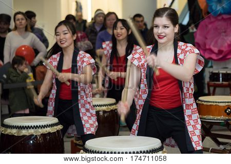 Moscow, Russia - March 5, 2017: Group Of Japanese Taiko Drummers Girls Perform In 