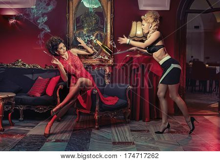 An accident in a restaurant, two elegant women