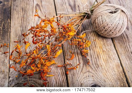 Dried flowers Crocosmia on wood. Studio Food Photo