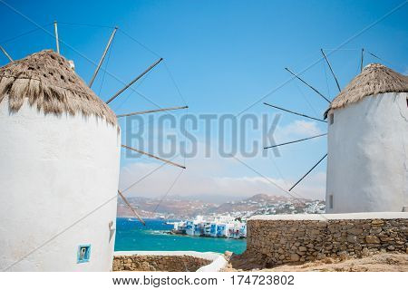 Old traditional windmills over the town of Mykonos.