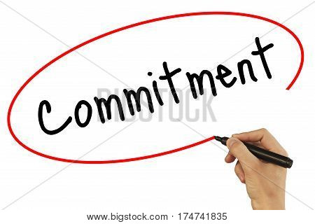 Man Hand Writing Commitment With Black Marker On Visual Screen. Isolated On Background. Business, Te