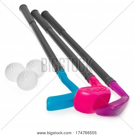 Mini golf set toy for children plastic golf stick and balls. Golf staves in the colors purple blue. Set to play isolated on white background with light shadow and reflection.